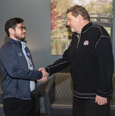 Vascular Surgeon Ben Fegale, MD, and Mark Cronquist shaking hands