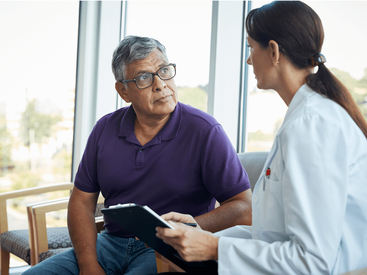 man listening to doctor